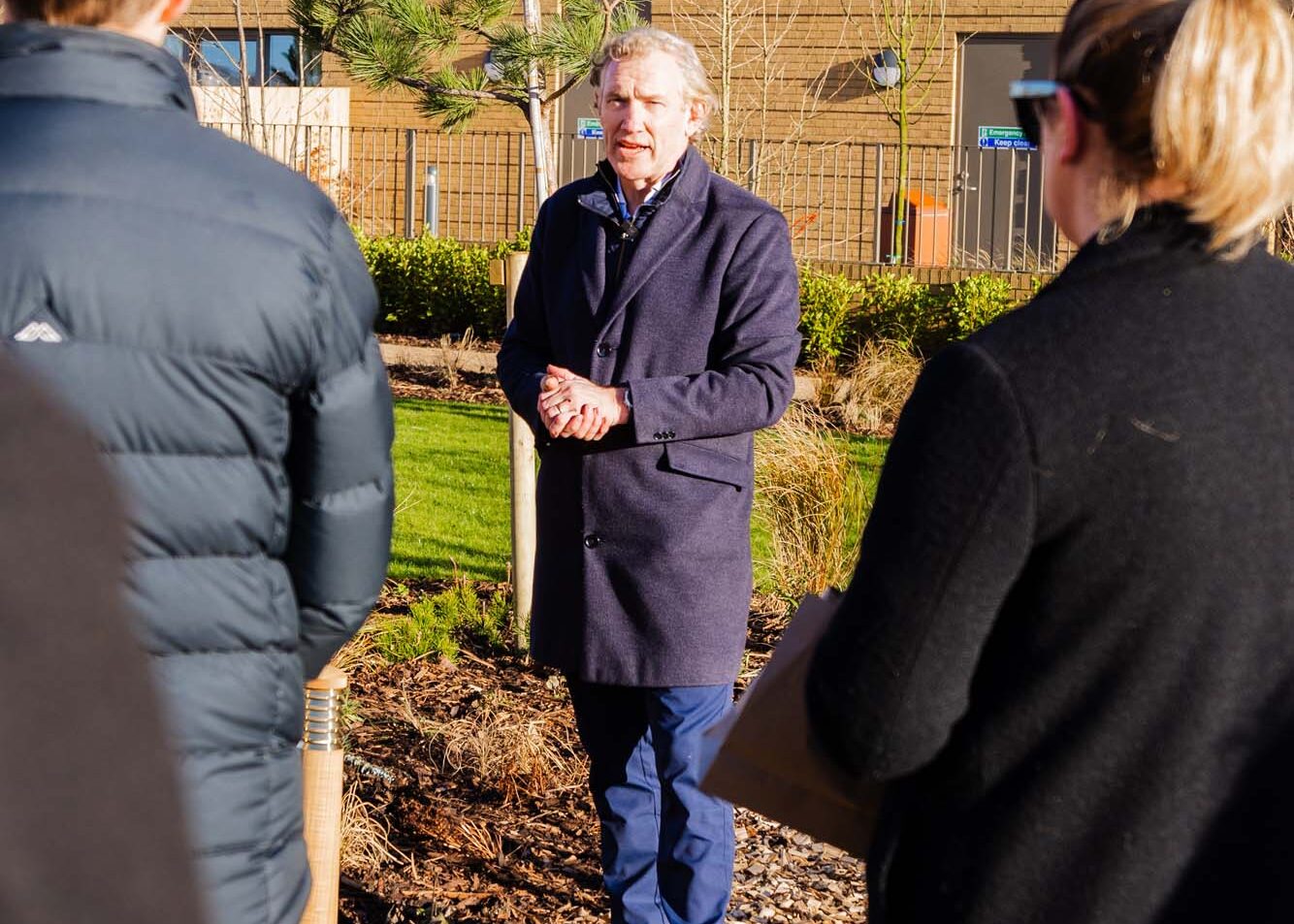 James Whittaker planting a tree at Chatham Waters