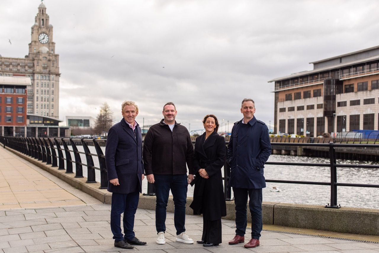 L-R James Whittaker MD of Peel Waters, Gareth Evans MD of Padel Ventures with Liza Marco and Chris Capes from Liverpool Waters at the site of the future floating Padel destination at Liverpool Waters Large